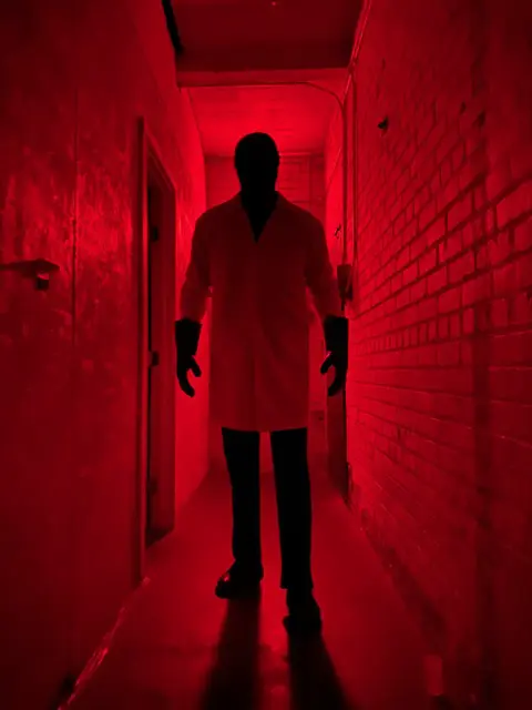 Dr. X at Horror Escapes LA hallway