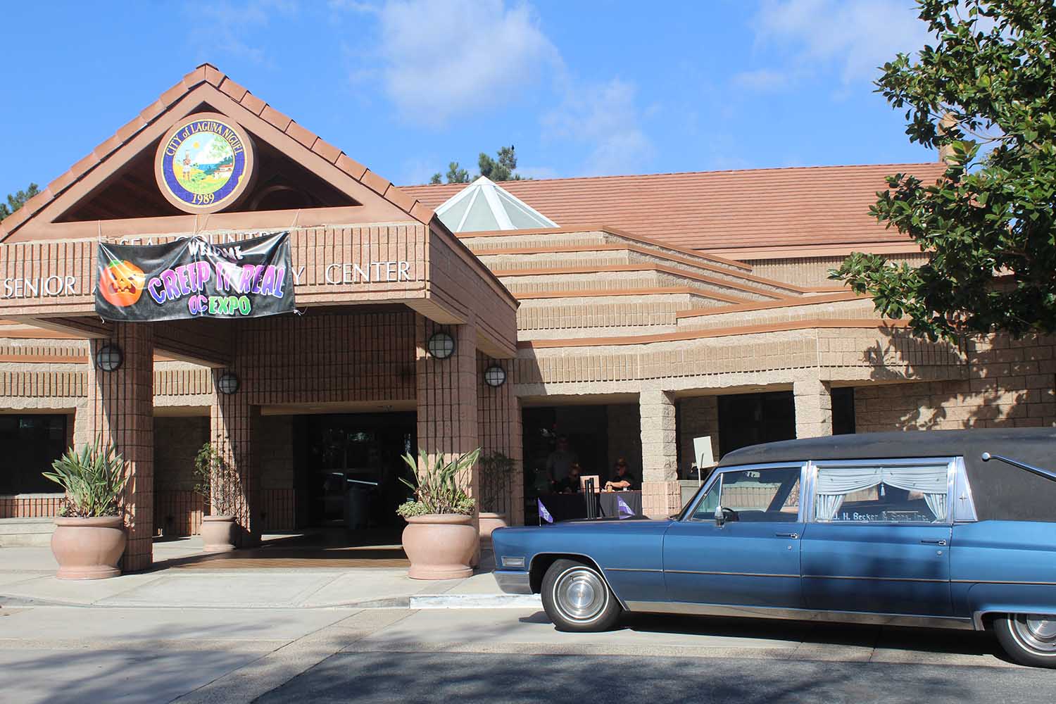 Front of Sea Country Community Center with hearse parked 